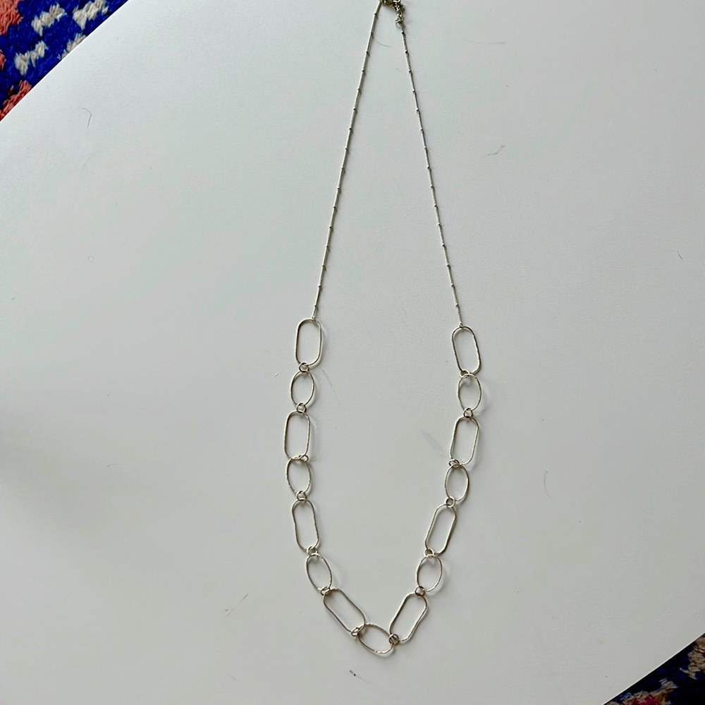 Lovely lightweight silver long necklace. Very unique.